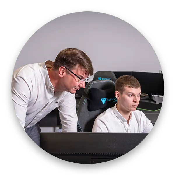 Cipher IT team at the office looking at a computer