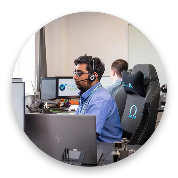 Far away shot of Cipher IT team member using a VOIP headset