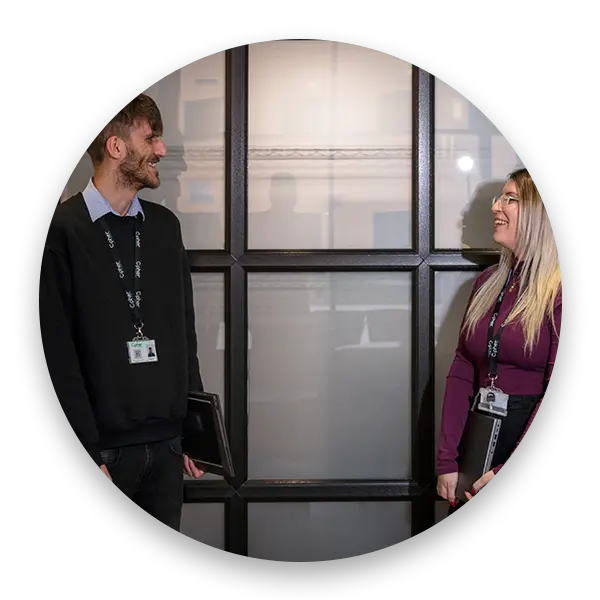 Two Cipher IT team members standing together