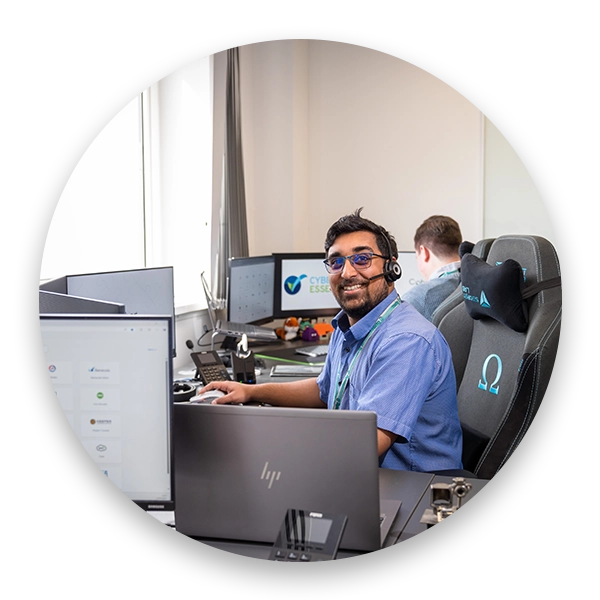 Cipher IT team working in the office looking at the camera